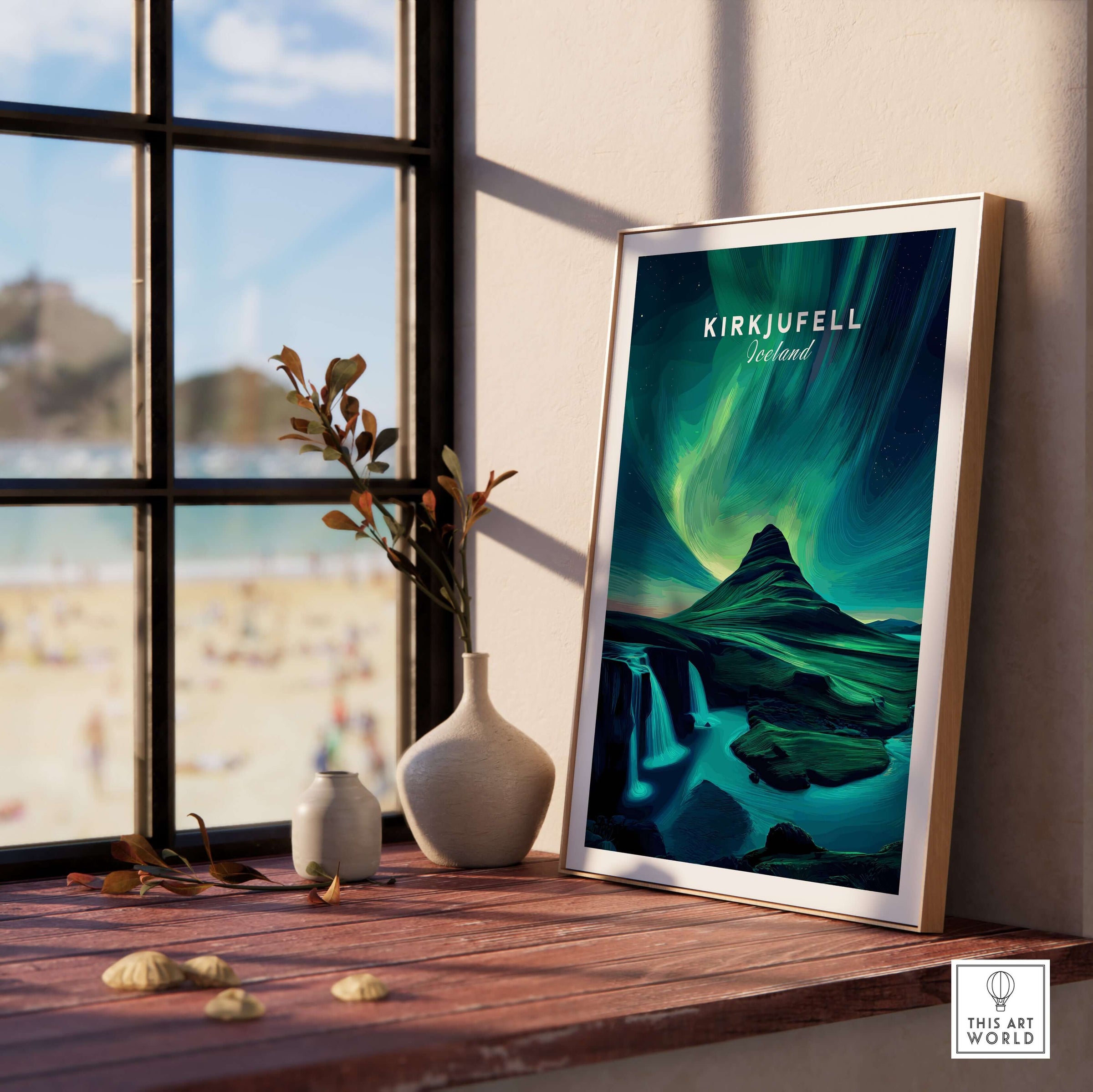 Kirkjufell Northern Lights Scenery Print | Icelandic Nature Wall Decor in a stylish frame on a wooden table with a window view.