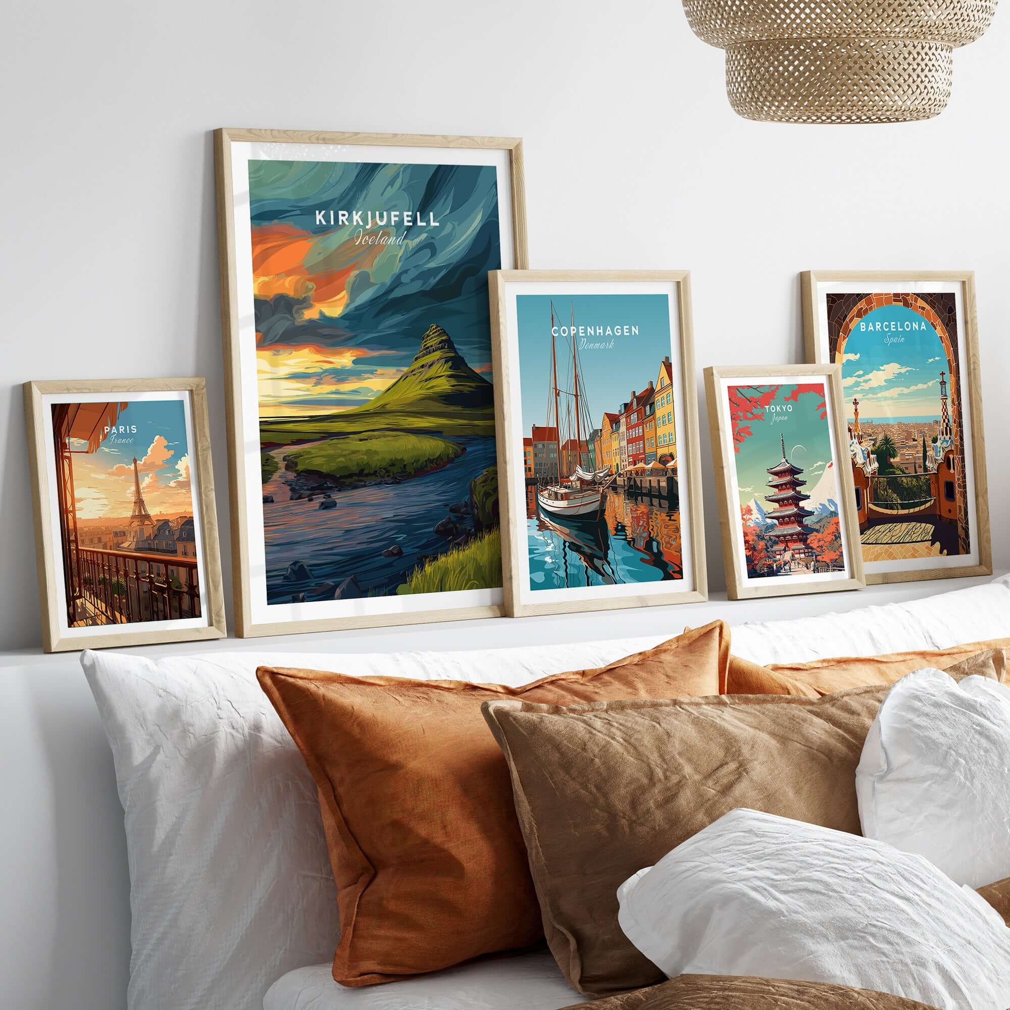 Kirkjufell Poster Snæfellsnes Print | Icelandic Landscape Decor framed among other art prints on a stylish sofa.
