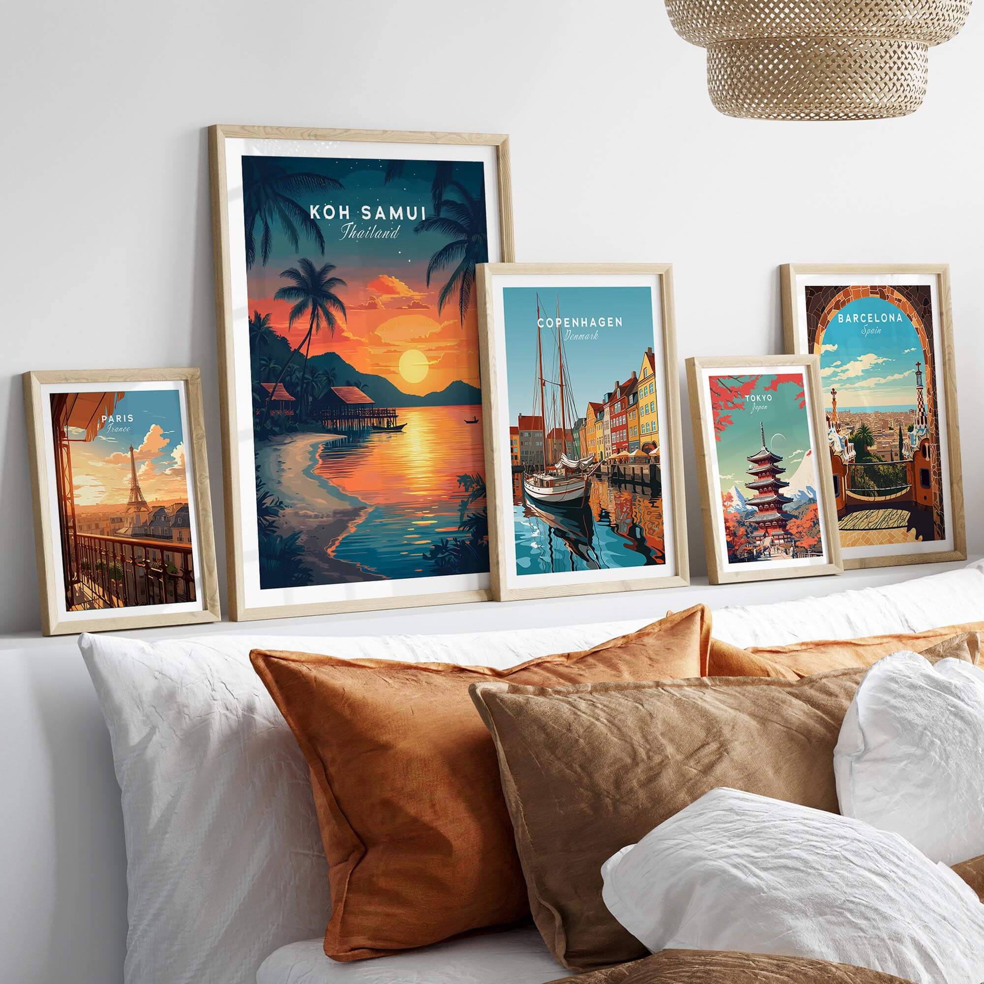 Koh Samui Thailand Wall Art framed prints displayed above a cozy sofa, showcasing vibrant tropical designs.