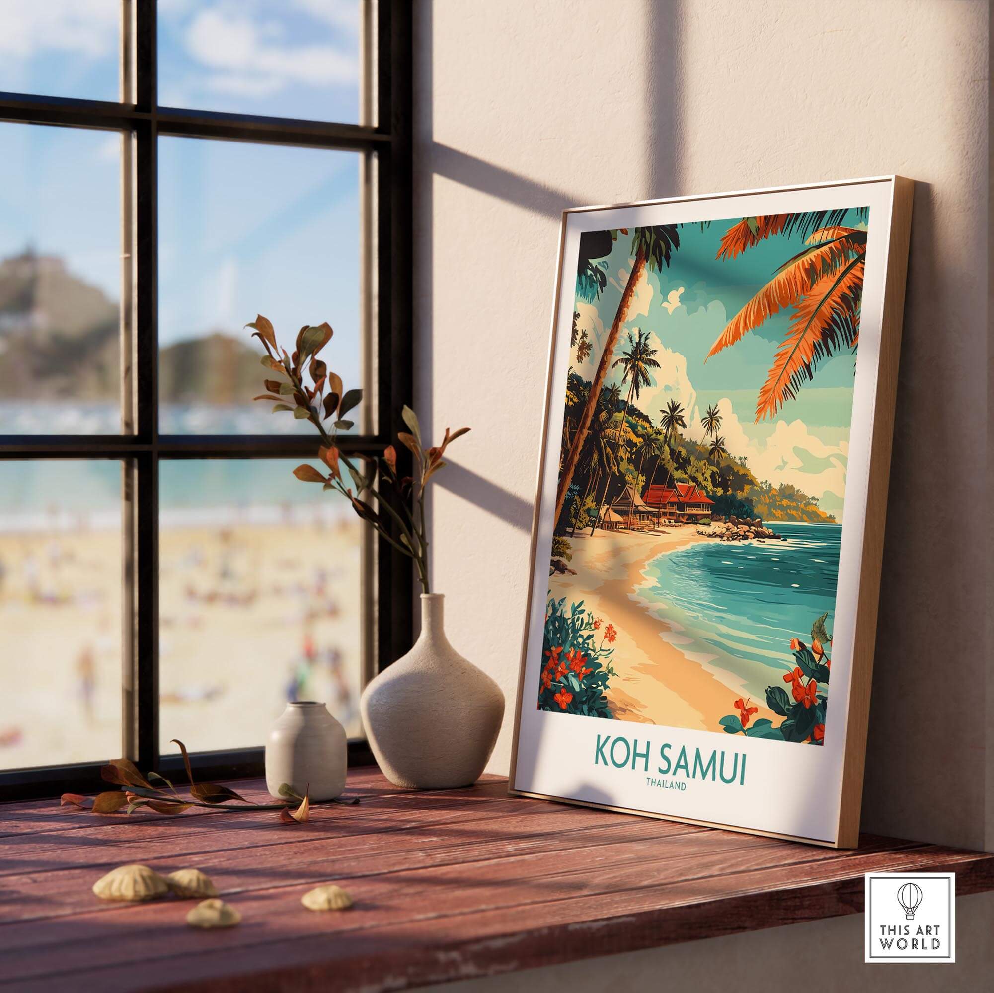 Koh Samui Wall Art Print displayed on a wooden table with beach view, showcasing vibrant colors and tropical ambiance.