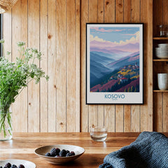 Kosovo Art Print | Pastel Landscape Poster displayed on a wooden wall with greenery and a bowl of berries.