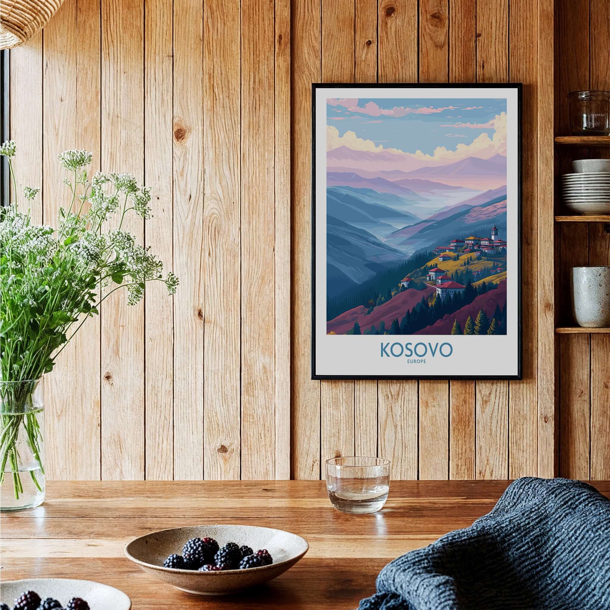 Kosovo Art Print | Pastel Landscape Poster displayed on a wooden wall with greenery and a bowl of berries.