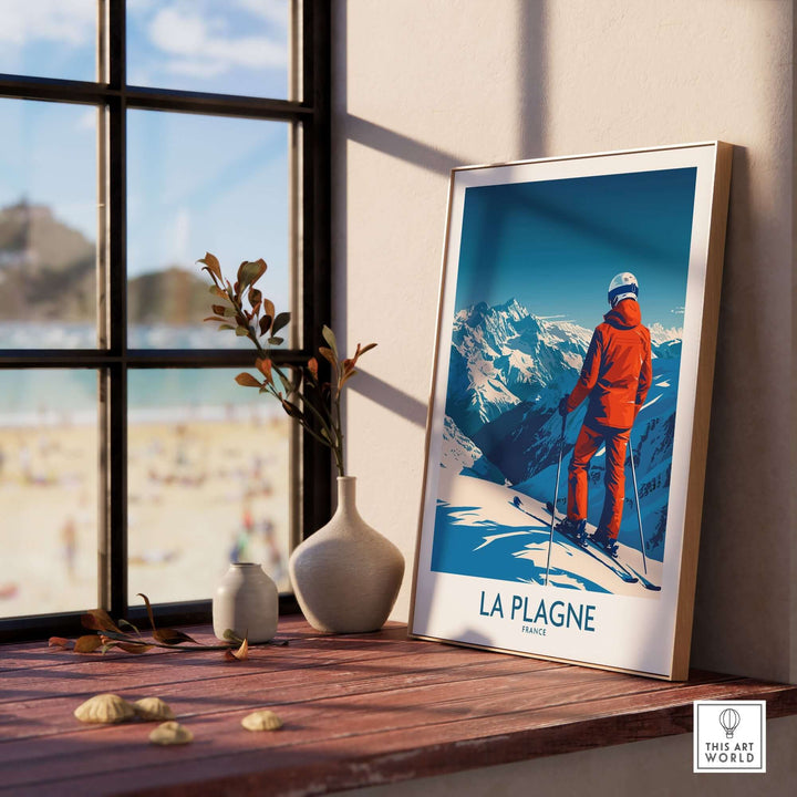 La Plagne ski poster framed by a window, showcasing the beauty of the French Alps and inspiring winter adventure.