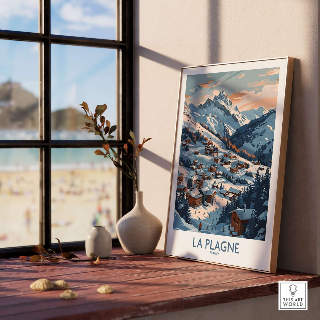 La Plagne wall art featuring a winter landscape in a scenic mountain village, displayed near a window with decorative vases.