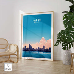 Lagos Nigeria Poster featuring vibrant city skyline with clouds and blue sky, ideal for home or office decor.