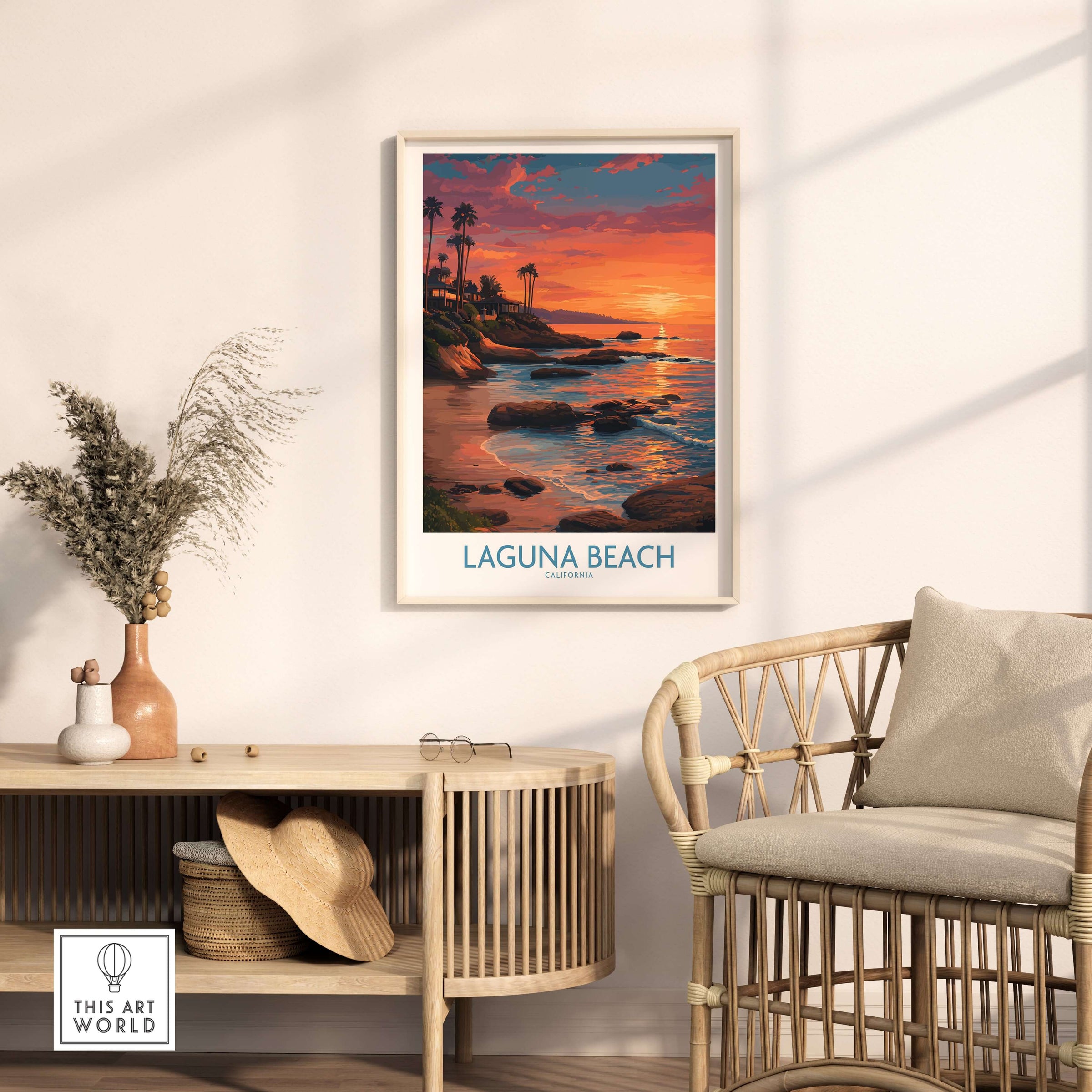 Laguna Beach California Sunset Art Print | Vibrant Coastal Poster framed on a wall above stylish furniture.