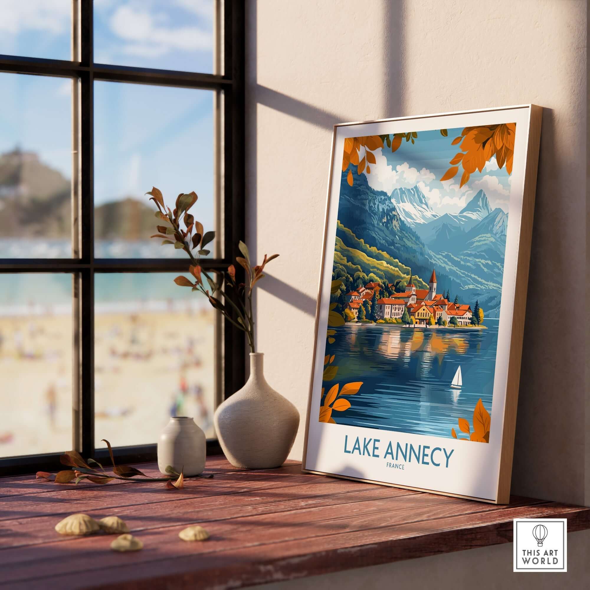 Lake Annecy Travel Poster France displayed in a bright room with a view of the lake and mountains in the background.