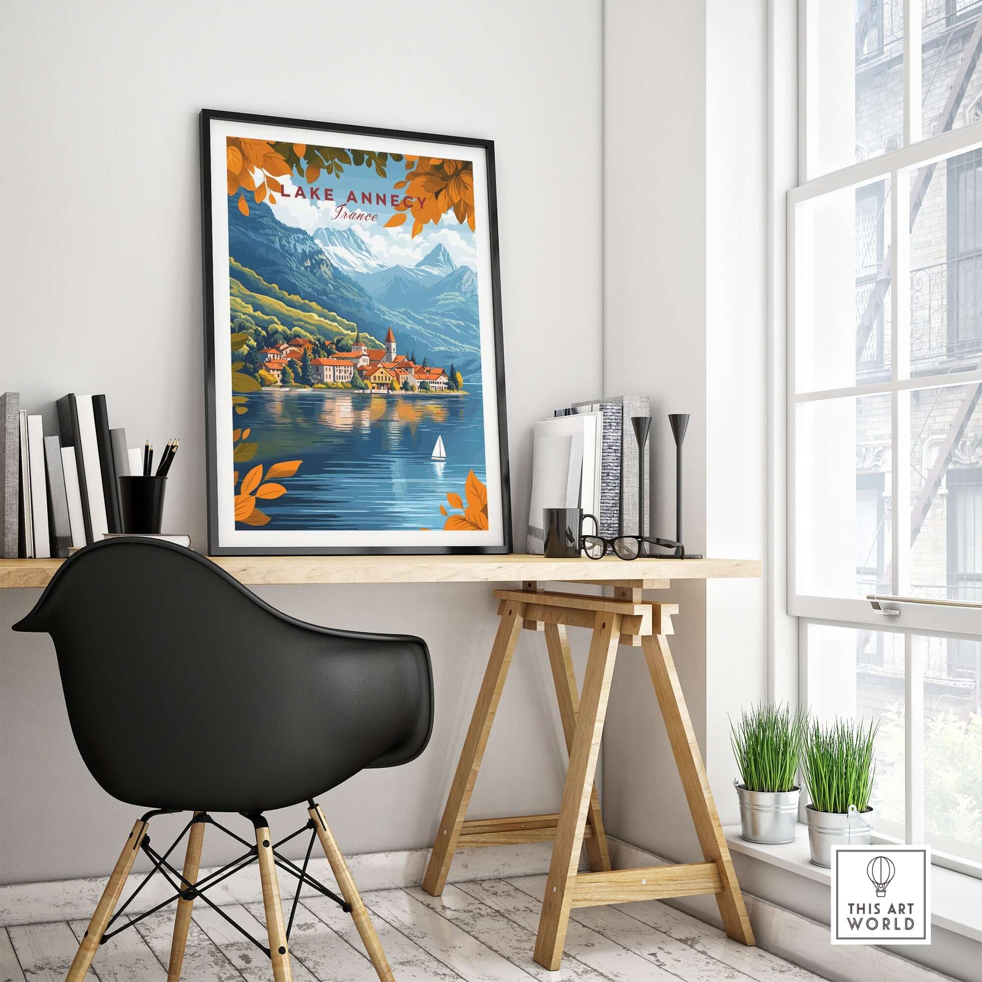 Lake Annecy Travel Print France displayed in a stylish workspace, showcasing vibrant colors and picturesque scenery.