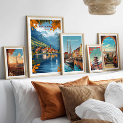 Lake Annecy Travel Print France displayed among various travel prints in a cozy home setting, showcasing vibrant designs.
