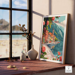 Lake Iseo Wall Art Poster displayed on a wooden table near a window, showcasing serene lake scenery and vibrant flowers.