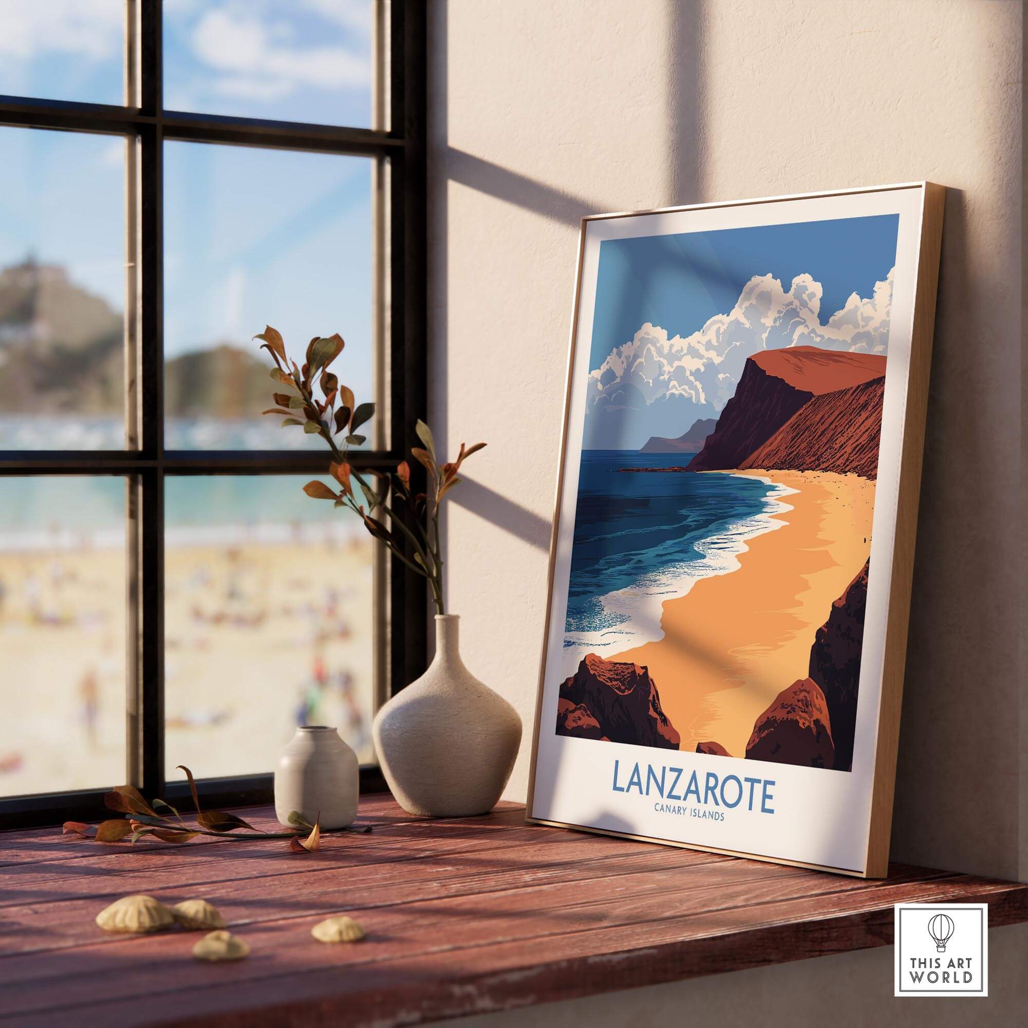 Lanzarote Poster Canary Islands Spain displayed in a sunny room with beach and wave view in the background.