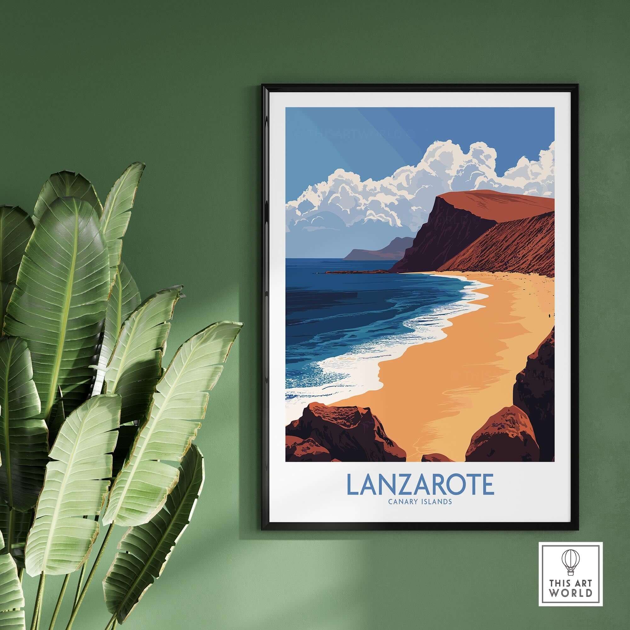 Lanzarote Poster Canary Islands Spain framed on wall with beach scene and tropical plant.