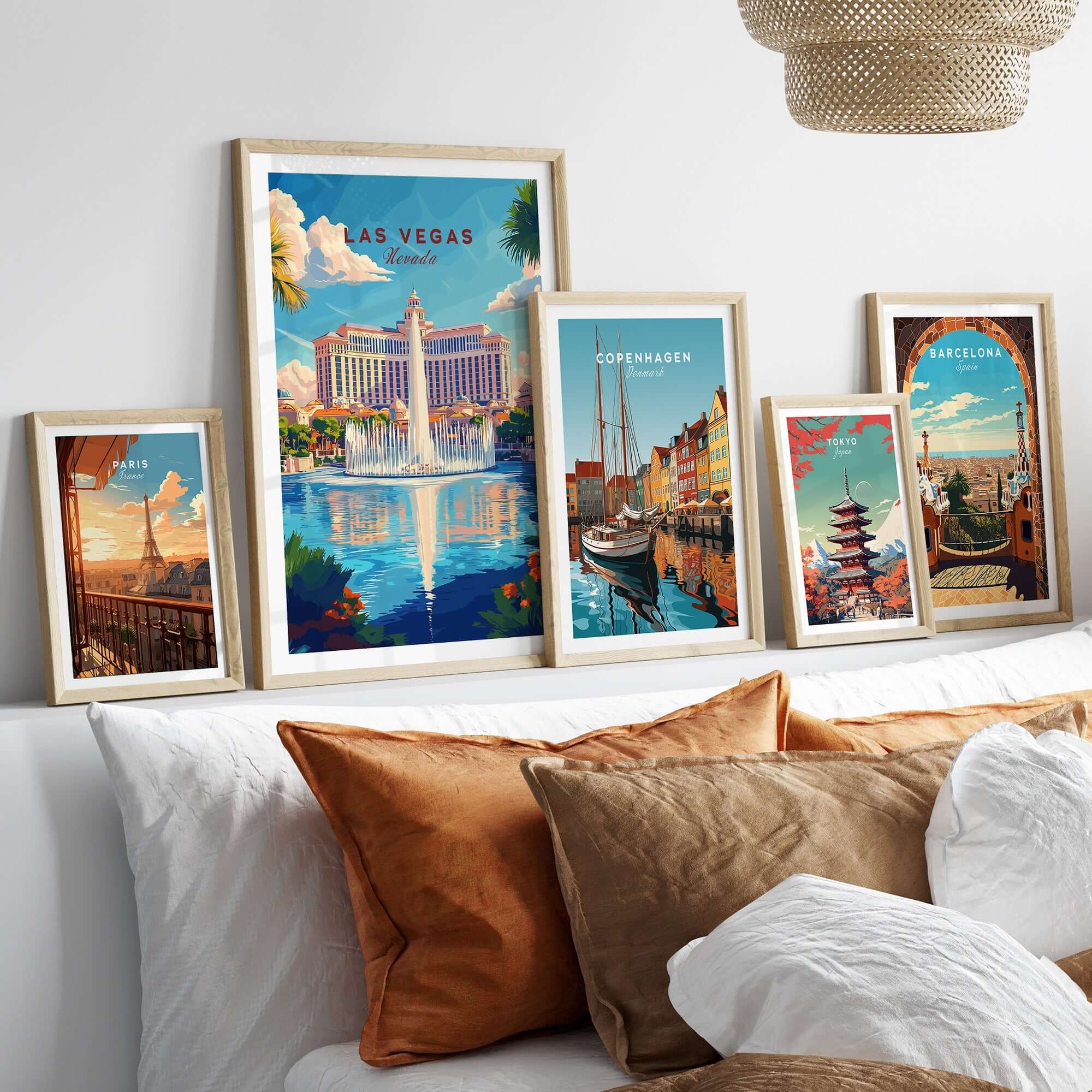 Las Vegas Travel Print collection of framed travel art prints on a stylish bed, showcasing vibrant cityscapes.