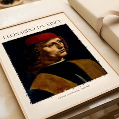 Leonardo da Vinci Art Print -  Portrait of a Musician 1480s Early Male Portrait Art Print displayed on a table.