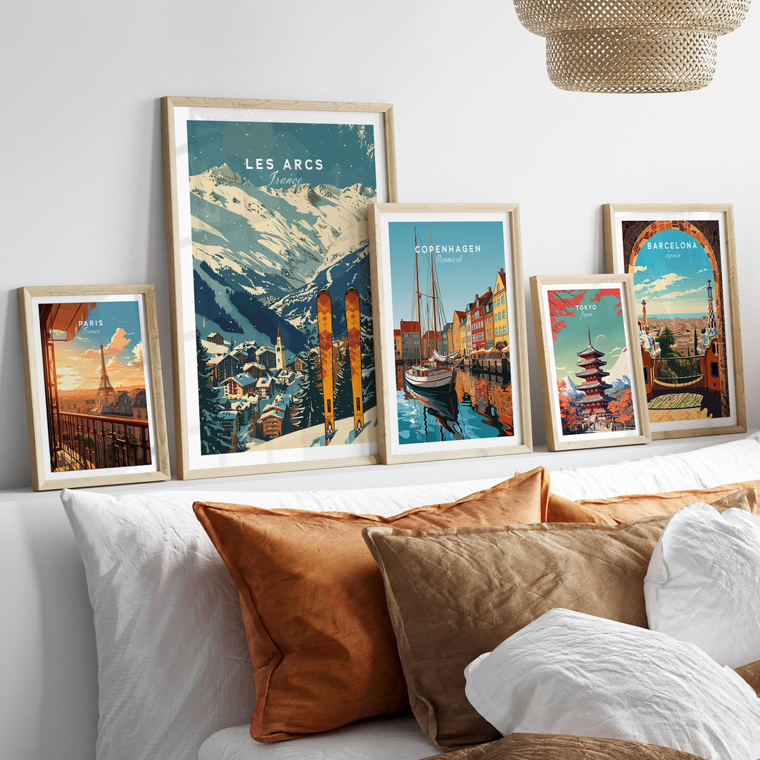 Collection of travel posters including a Les Arcs Ski Poster, displayed in a stylish living room setting.