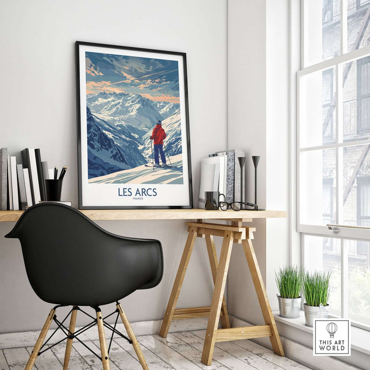 Les Arcs ski print displayed in a modern office setting, featuring stunning mountain scenery and a skier.