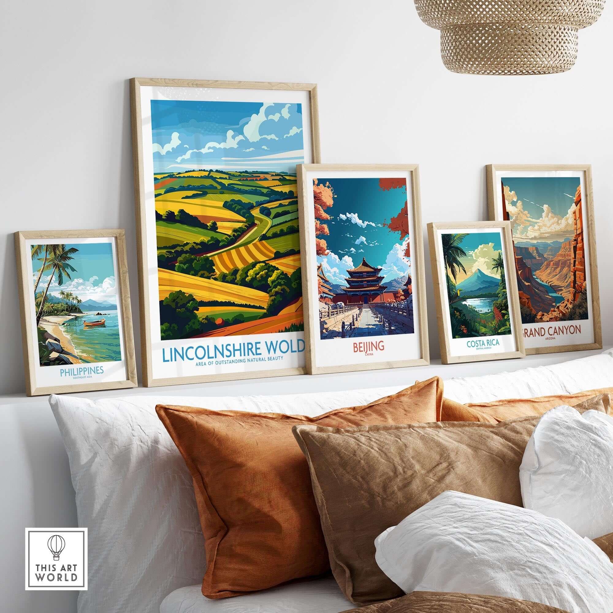 Lincolnshire Wolds Print displayed among various travel-themed wall art prints on a cozy sofa.