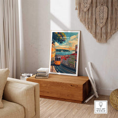 Lisbon Travel Print displayed in a cozy living room, showcasing vibrant streets and landmarks of Lisbon.