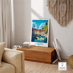 Ljubljana Print Slovenia displayed in a stylish living room on a wooden chest, showcasing the beauty of Ljubljana.