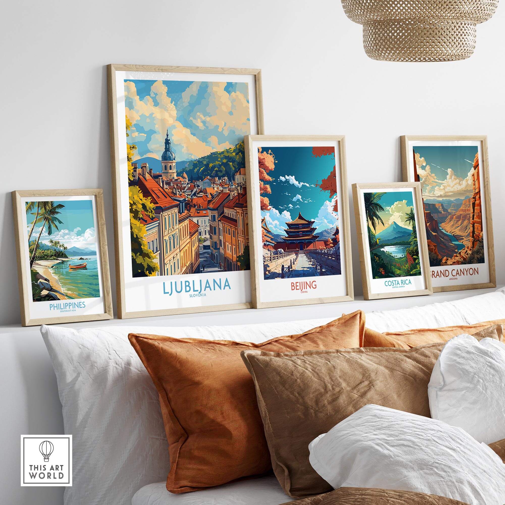 Ljubljana Travel Poster displayed among travel art prints on a stylish shelf with decorative pillows.