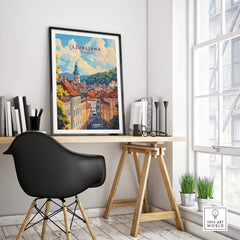 Ljubljana Travel Print framed art piece displayed in a modern workspace with a black chair and natural light.