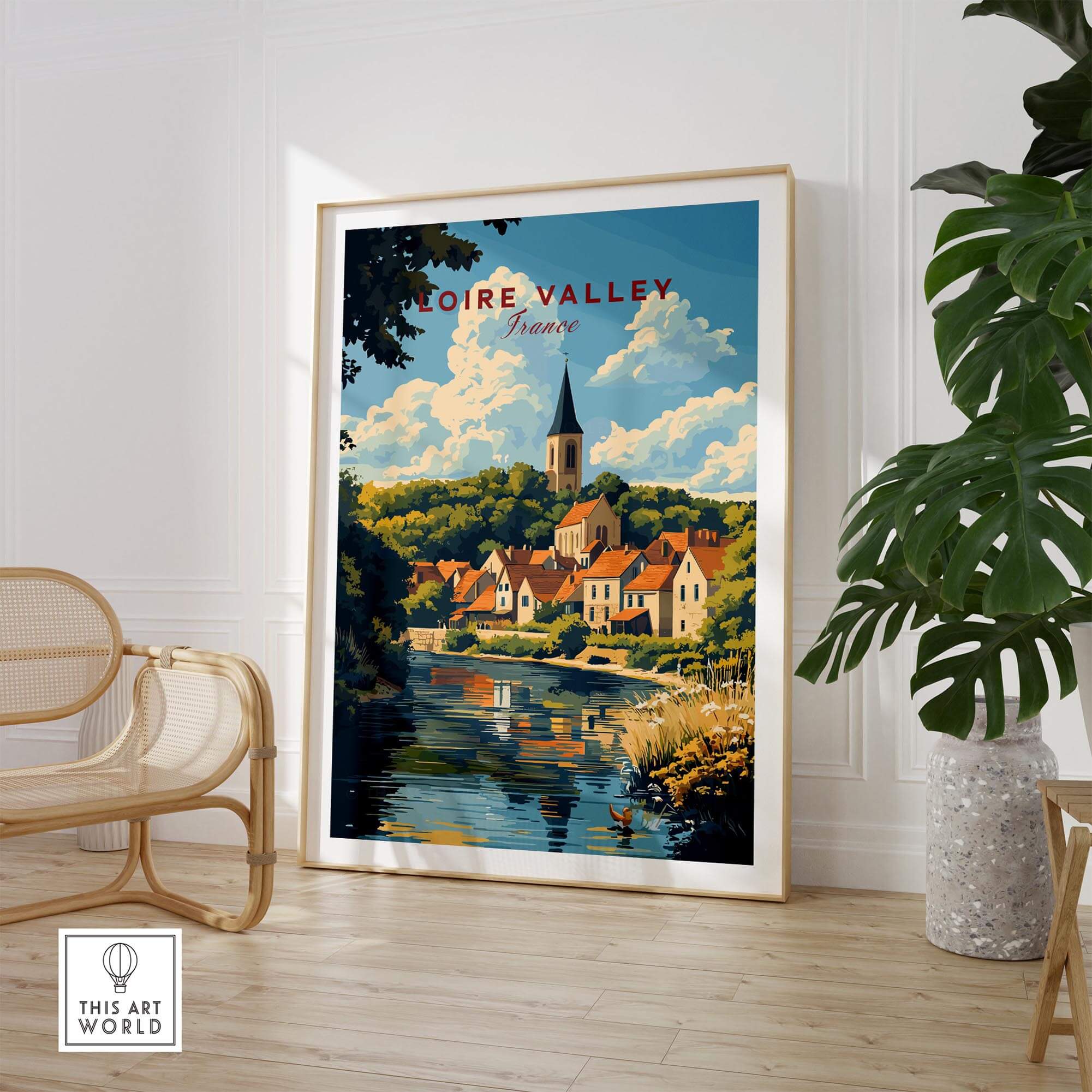 Loire Valley France Travel Print showcasing a scenic landscape with charming buildings by a river.