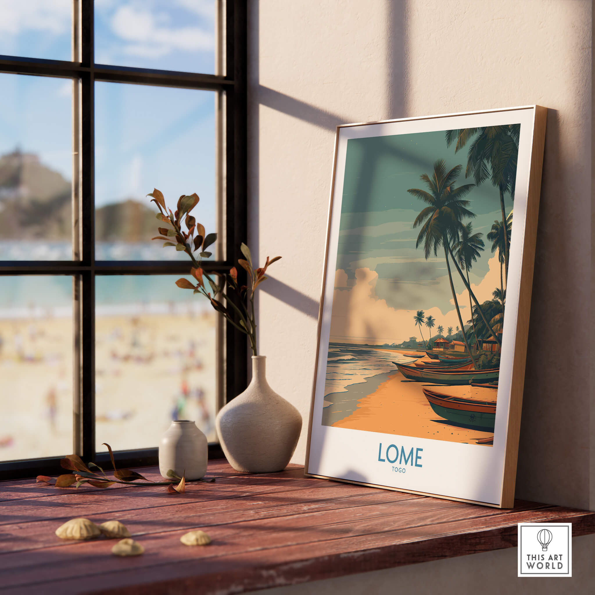 Lomé Togo Canvas Print | Palm Trees & Ocean View Poster displayed on a wooden table by a window.