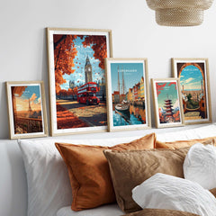 London Travel Print showcasing Big Ben and a red bus, surrounded by other city prints on a cozy couch.