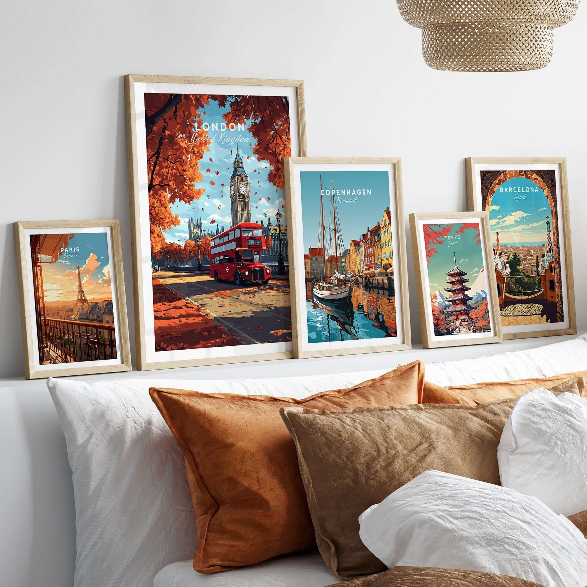 London Travel Print showcasing Big Ben and a red bus, surrounded by other city prints on a cozy couch.