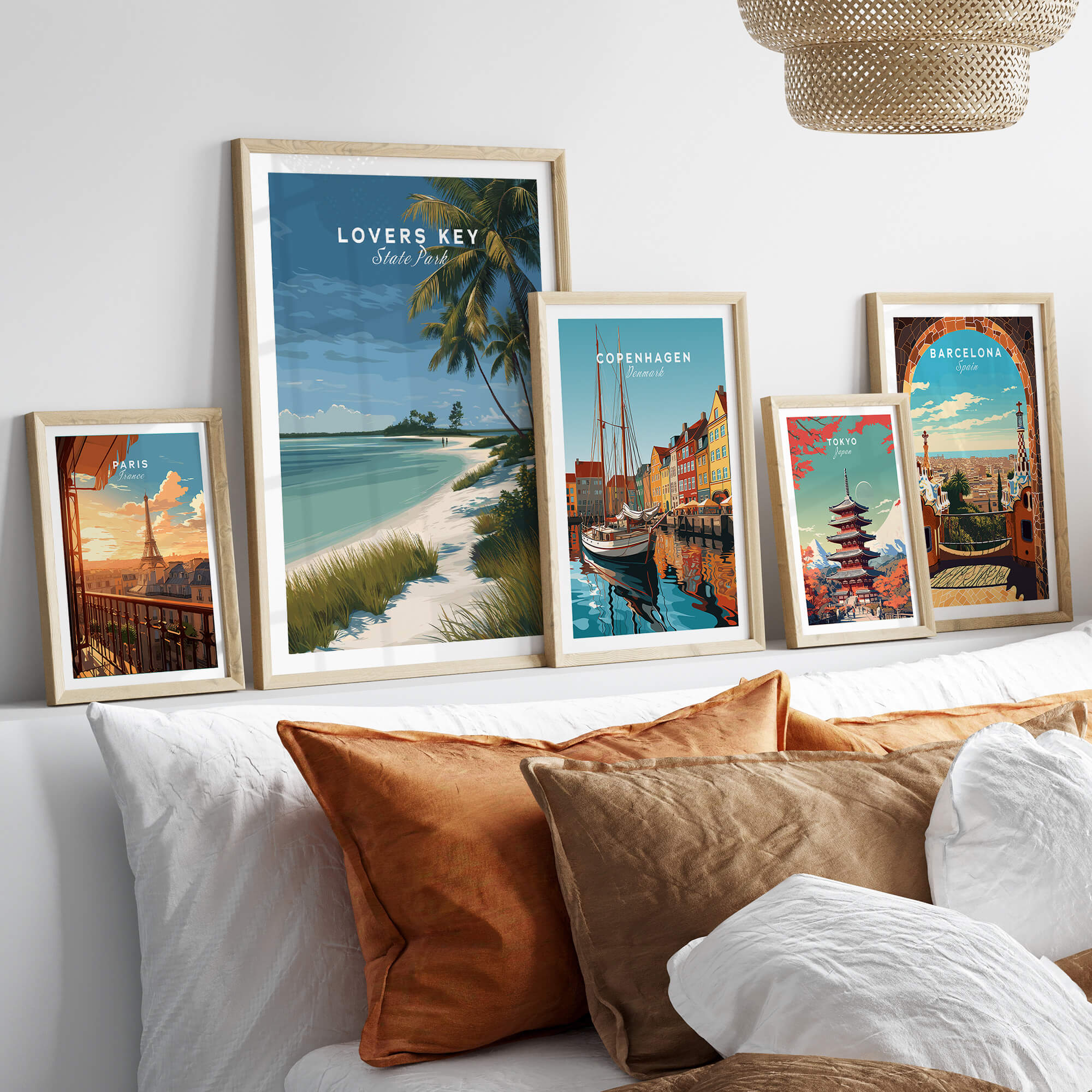 Lovers Key Florida Travel Poster | Coastal Path & Dunes Wall Art Print displayed with other travel posters on a cozy sofa.