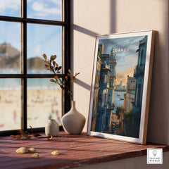 Luanda Print - African Cityscape Poster - Coastal Travel Decor displayed on a wooden shelf near a window.