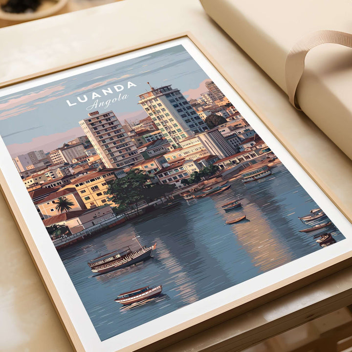 Luanda art print depicting traditional boats on Kwanza River with vibrant city skyline, perfect wall decor.