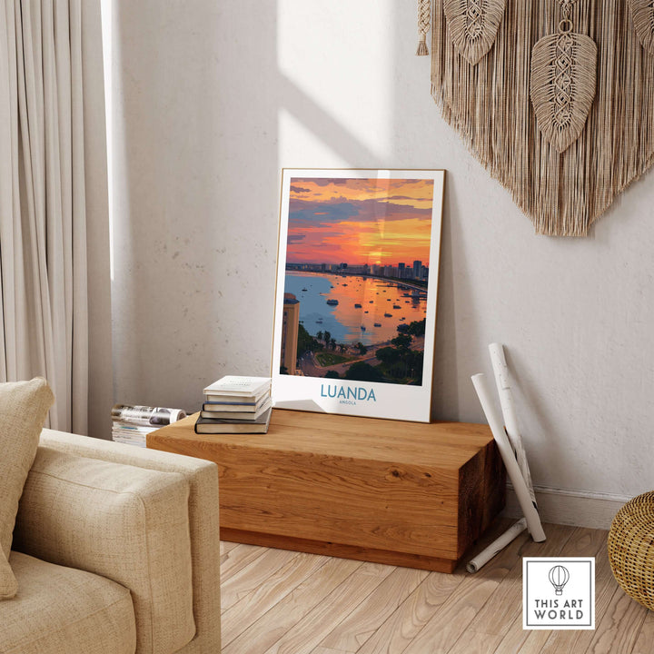 Luanda poster featuring a sunset over Angola Bay cityscape, displayed as wall decor in a cozy living room.