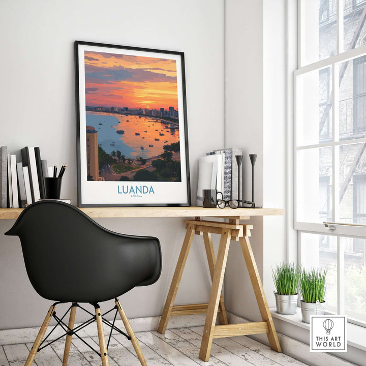 Luanda cityscape sunset art print displayed on desk, highlighting Angola's vibrant waterfront scenery.