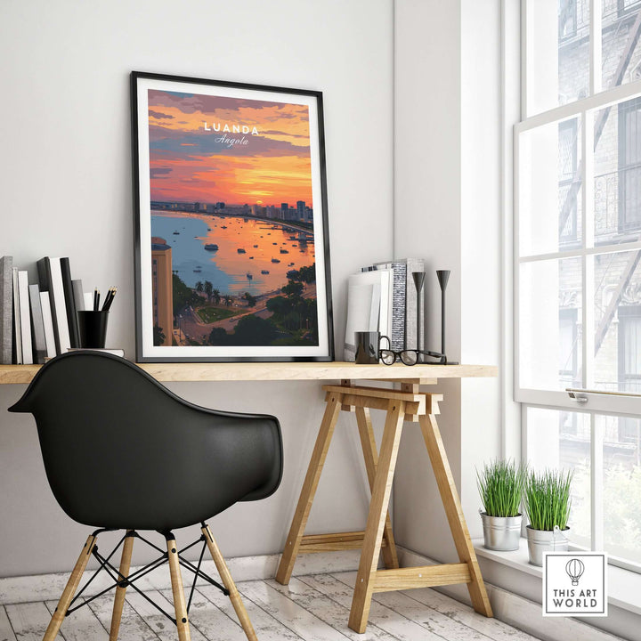 Luanda Skyline at sunset poster displayed in a modern workspace, showcasing vibrant colors and waterfront view.