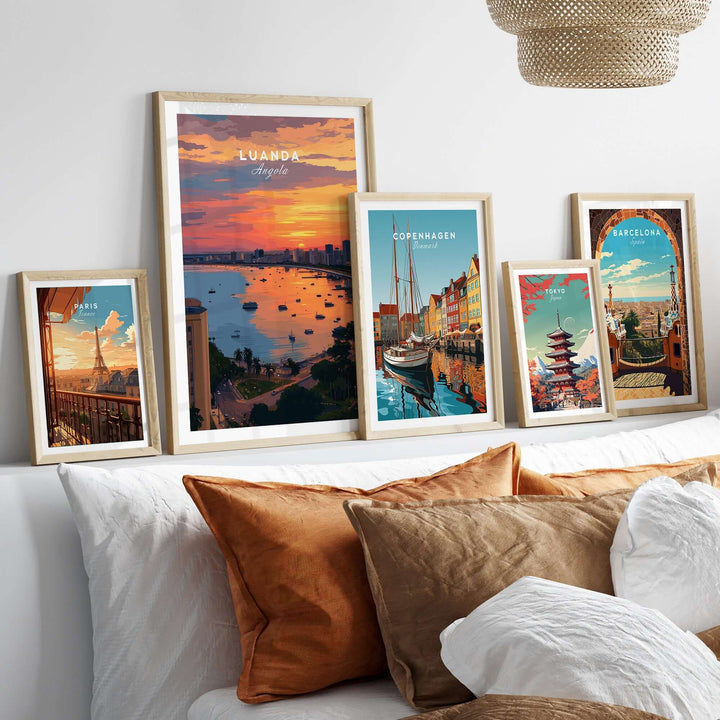 Luanda skyline sunset poster among framed city prints on a stylish couch, perfect for travel-themed wall decor.