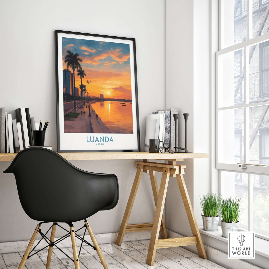 Luanda sunset art print displayed in a modern workspace, showcasing vibrant colors and urban waterfront scenery.