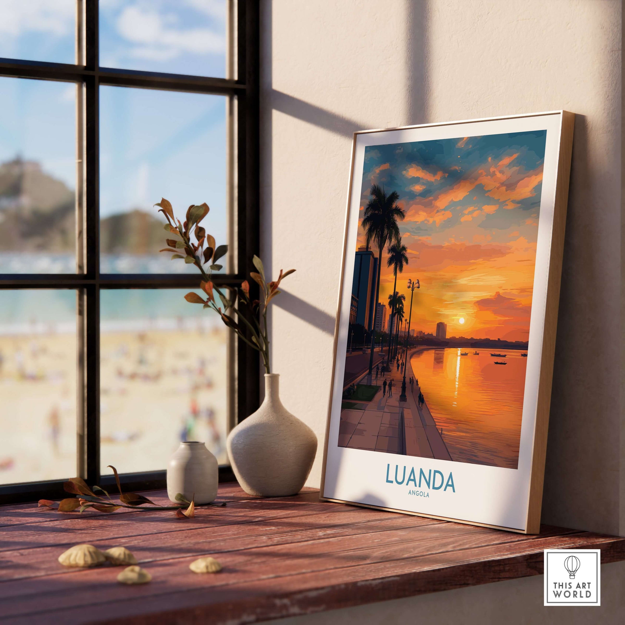 Luanda Sunset Poster - Angola Waterfront Art Print - Wall Decor displayed on a wooden table near a sunny window.