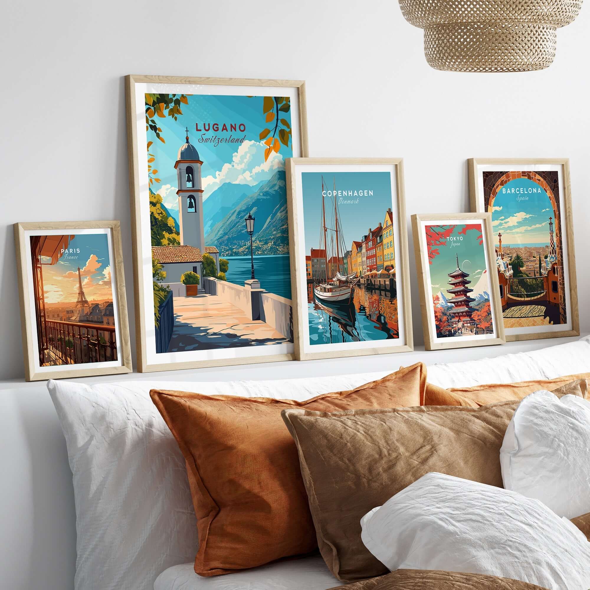 Lugano Wall Art Poster displayed among other vibrant city posters on a stylish sofa arrangement.