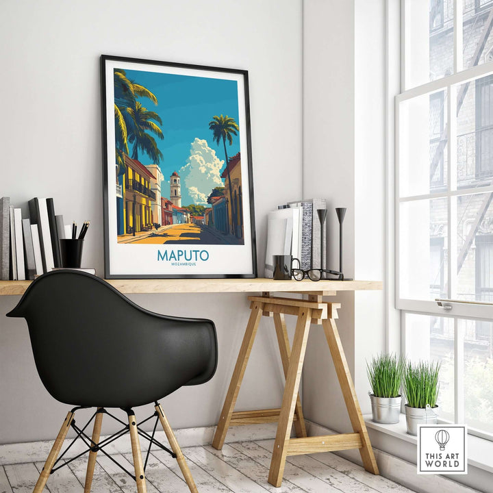 Maputo travel poster on desk in modern home office, capturing vibrant Mozambique street scene, perfect for Africa travel enthusiasts.