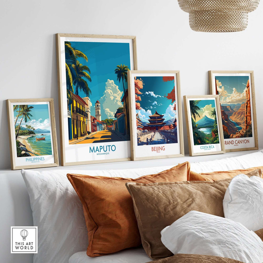 Maputo travel poster and other destination wall art prints displayed on a white shelf above a sofa.