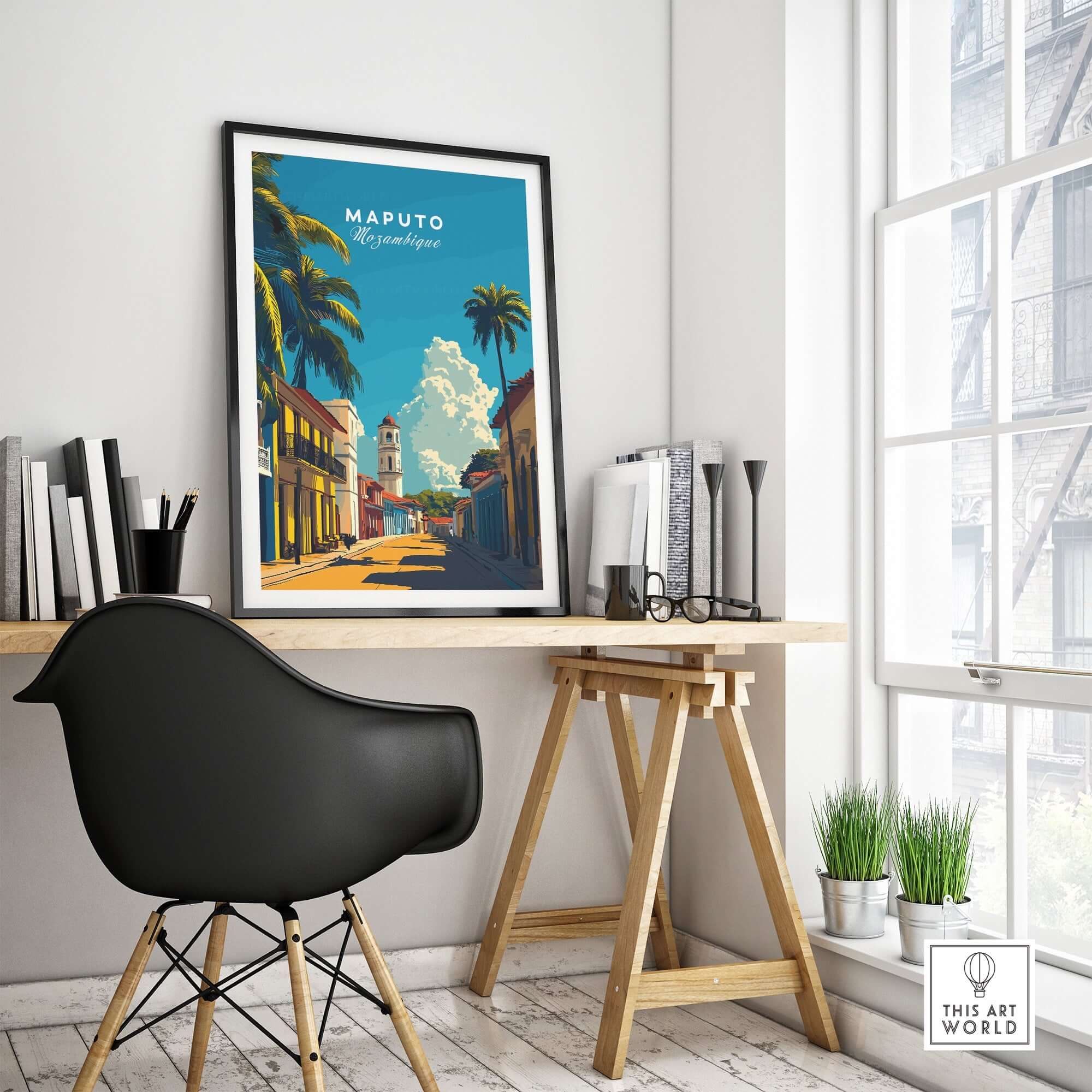 Maputo Travel Print Mozambique framed in a modern interior setting with desk and plants, showcasing vibrant architecture.