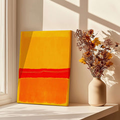Mark Rothko No 5 No 22 Abstract Canvas Art Print Yellow Orange Red displayed in a bright room with flowers.