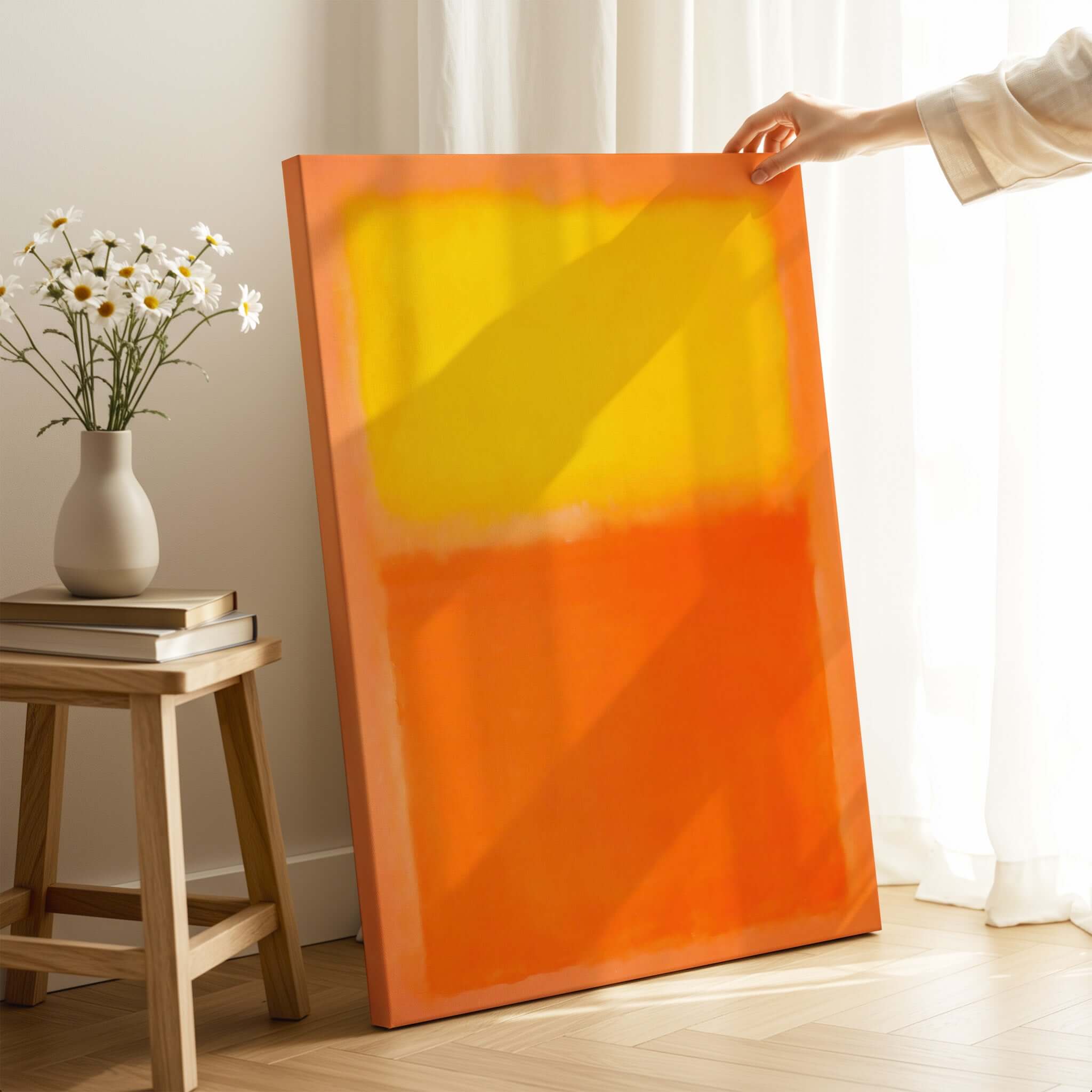 Mark Rothko Orange and Yellow 1956 Canvas Art Print displayed in a bright room with flowers.