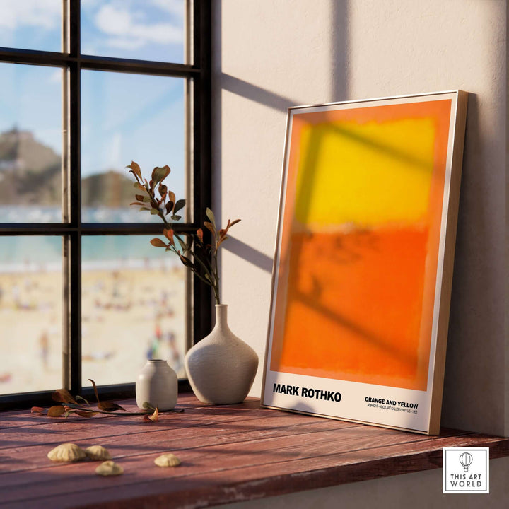 Mark Rothko Orange and Yellow 1956 art print displayed in a sunlit interior with beach view.