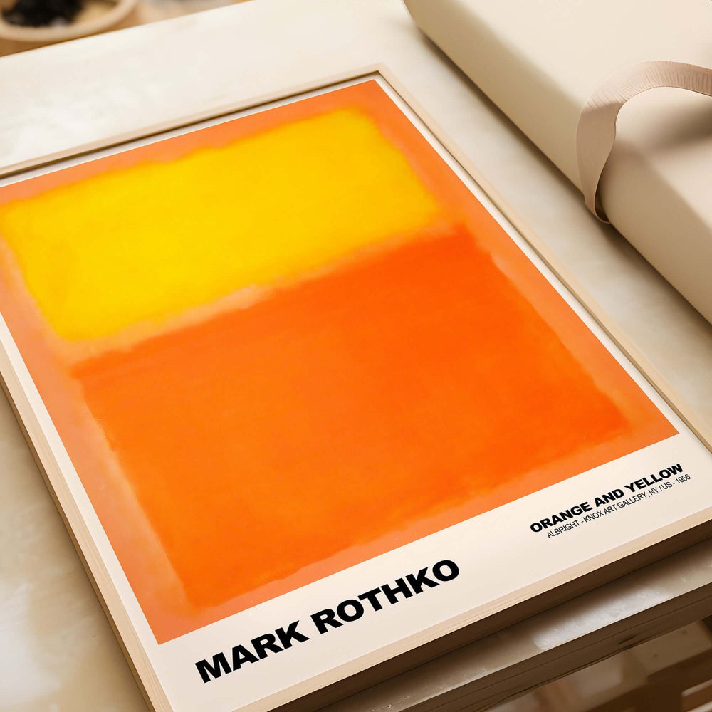 Mark Rothko Orange and Yellow 1956 Abstract Expressionism Art Print Color Field Poster displayed on a table.