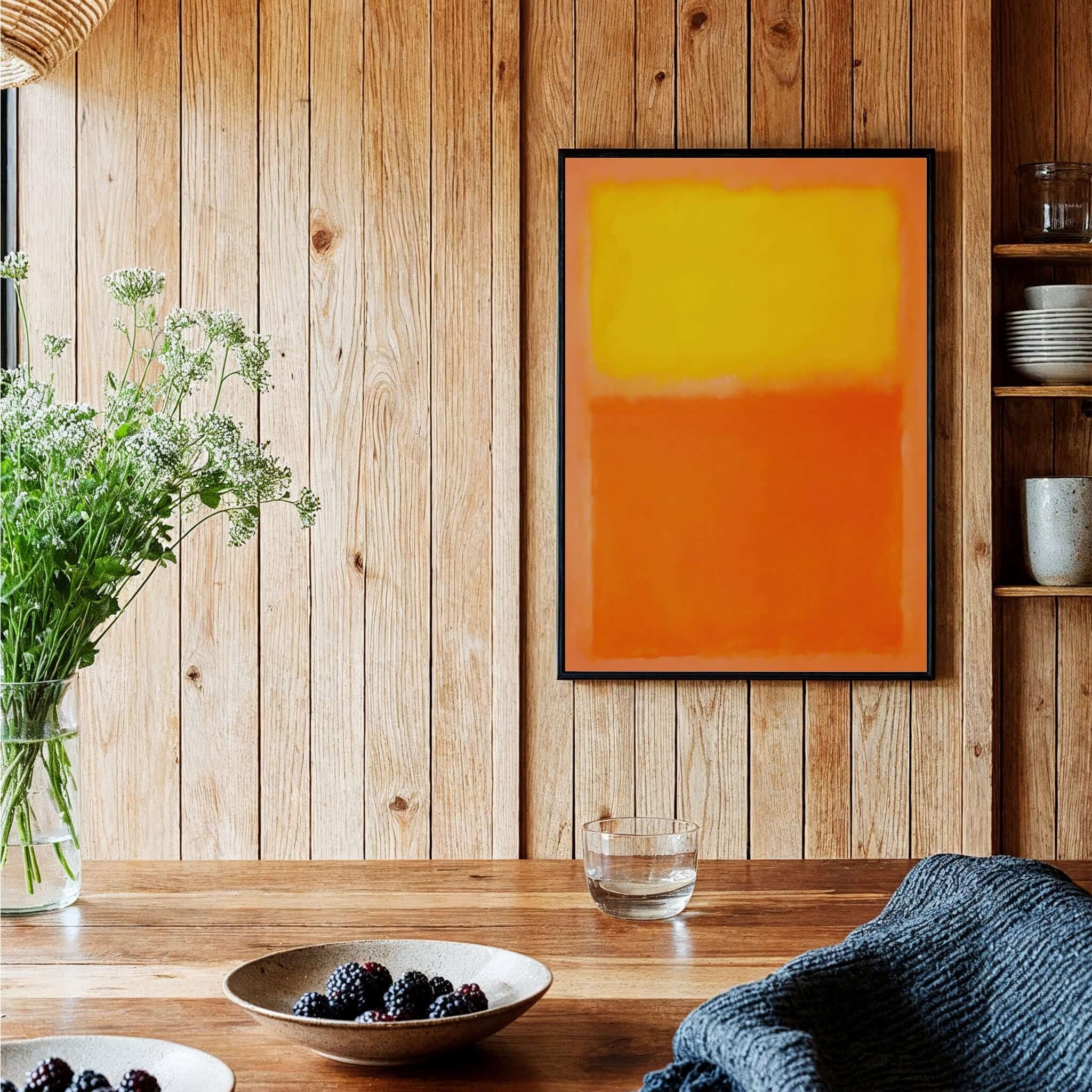 Mark Rothko Orange and Yellow 1956 Canvas Art Print displayed in a cozy wooden interior with flowers and fruit.