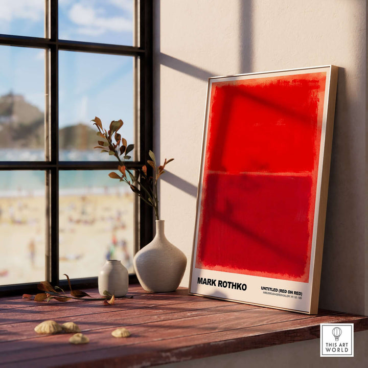 Mark Rothko Untitled Red on Red 1969 abstract art print displayed on a windowsill with beach view.