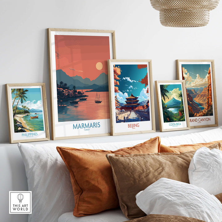 Framed art prints of coastal and scenic locations, featuring a Marmaris sunset poster, displayed on a stylish shelf.