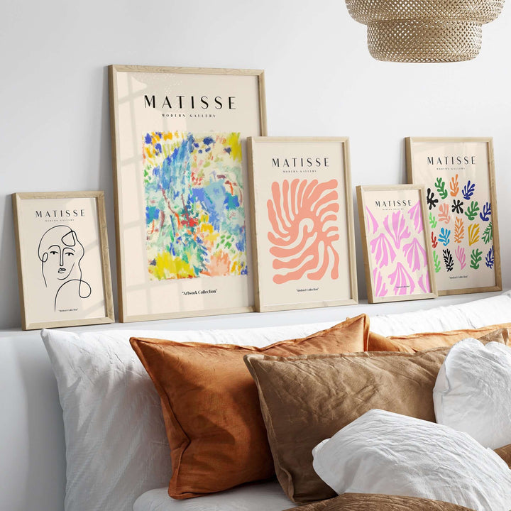 Gallery of Matisse art prints showcasing abstract designs and vibrant colors on a stylish shelf.